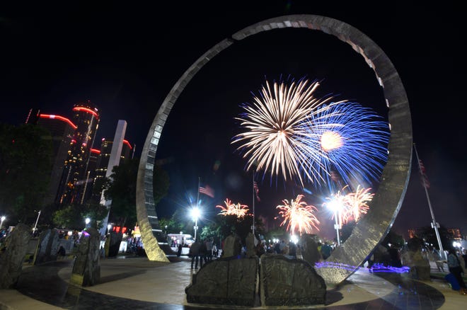 Fireworks seen through the statue 'Transcending,' by artists David Barr and Sergio de Guisti during the 2022 Ford Fireworks in Detroit, Michigan on June 27, 2022.