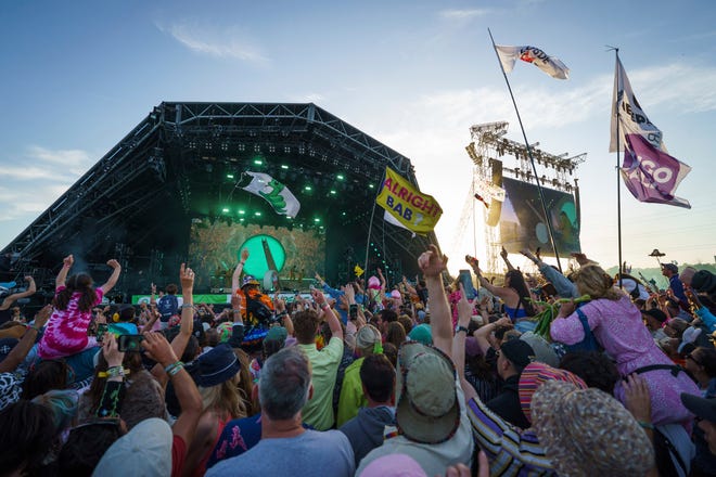 Festival goers watch Lorde perform at Glastonbury Festival on June 27, 2022.