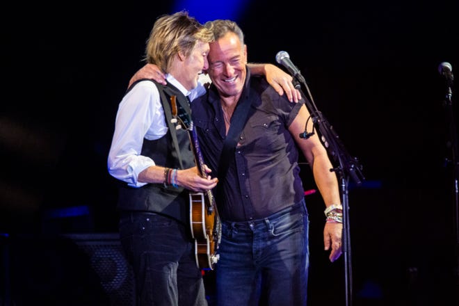 Paul McCartney, left, and Bruce Springsteen perform at Glastonbury Festival on June 25, 2022.