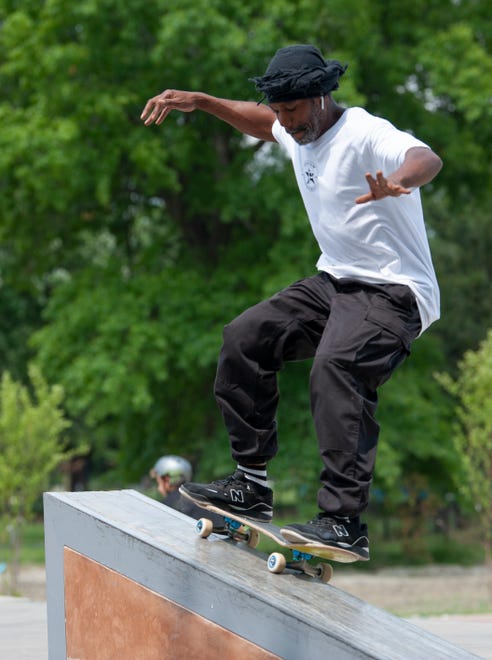 A skateboarder calling himself Mr. Premium shreds on the skate course at the new Chandler Park Skatepark in Detroit.
