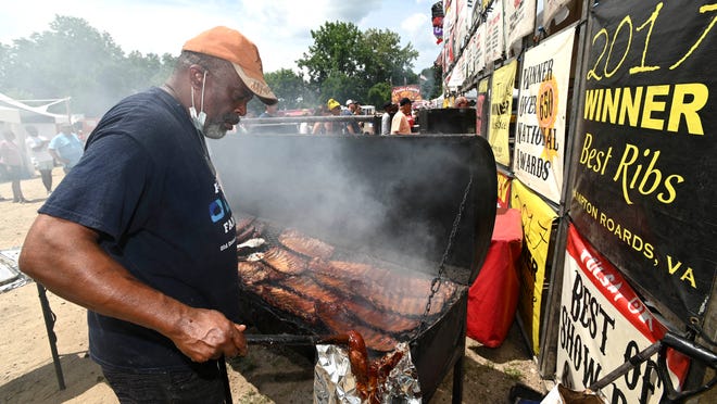 Johnson's Hickory Smoked Bar-B-Que's Kelvin Walston cooks ribs, Saturday afternoon, July 2, 2022. Johnson's is out of Norfolk, Va.