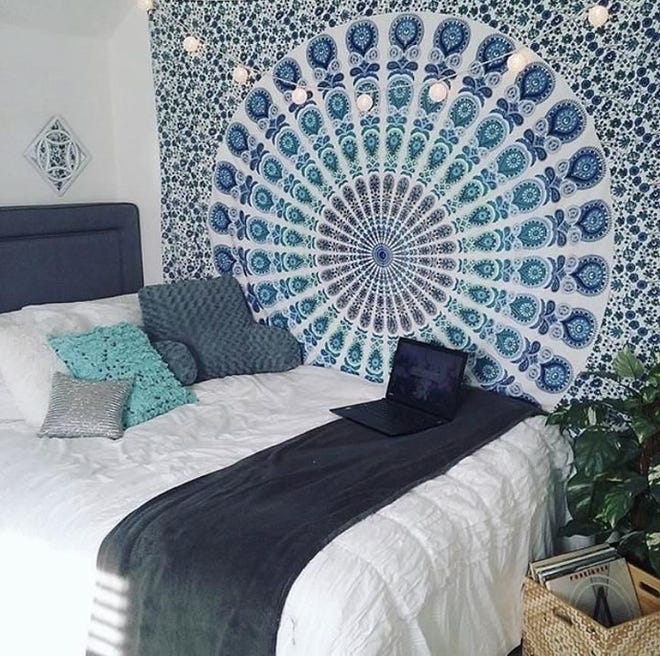 Colorful tapestries offer an affordable way to add a focal point to a small space like a college dorm or a starter apartment.