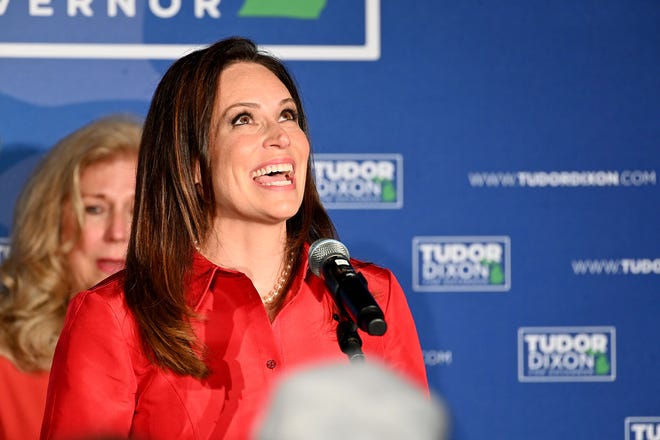 Republican gubernatorial candidate Tudor Dixon looks skyward and says "Thanks Dad" as she makes her victory speech at the Grand Hotel in Grand Rapids.