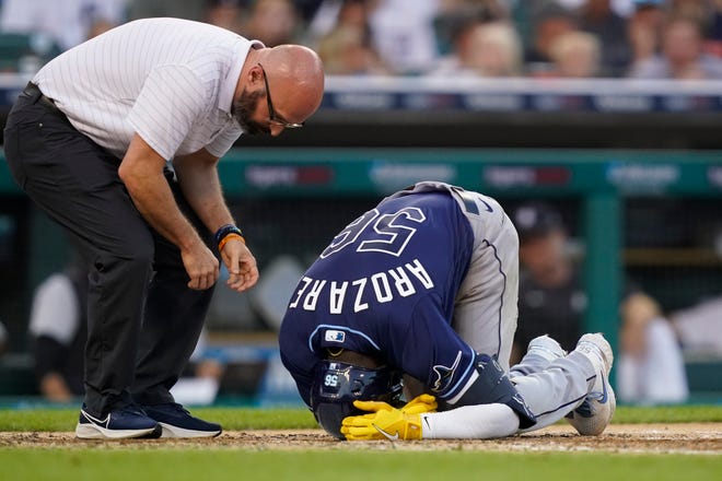 Rays' Randy Arozarena is checked on during the fourth inning.