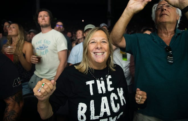 A Black Keys fan enjoys the band’s performance during their Dropout Boogie Tour at Pine Knob in Clarkston.
