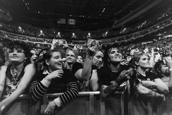 Fans enjoy the performance of the band My Chemical Romance at Little Caesars Arena in Detroit.