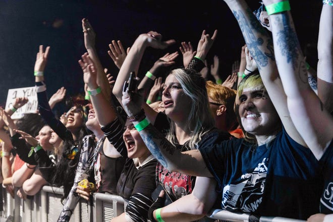 Fans cheer for the band My Chemical Romance at Little Caesars Arena in Detroit.
