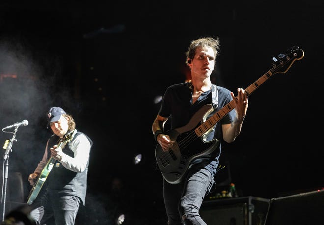 Bassist Mikey Way and rhythm guitarist Frank Iero, right, perform with My Chemical Romance at Little Caesars Arena in Detroit.