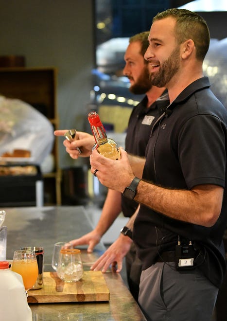 Kevin DeVries of Blake's Hard Cider Co. talks about the toasted lantern drink that is made with a reduced hard cider and spices at Dish and Design Cozy Comfort event at  Great Lakes Culinary Center in Southfield, Mich. on Sept. 20, 2022.