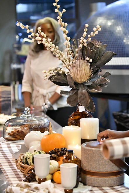 An example by Savvy Chic owner Karen Brown, not shown, of how to decorate for fall with silk flowers, battery operated candles and small gourds at Dish and Design Cozy Comfort event at  Great Lakes Culinary Center in Southfield, Mich. on Sept. 20, 2022.