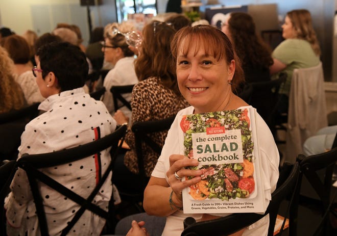 Andrea Kosla of Brighton won The Complete Salad Cookbook at Dish and Design Cozy Comfort event at  Great Lakes Culinary Center in Southfield, Mich. on Sept. 20, 2022.
