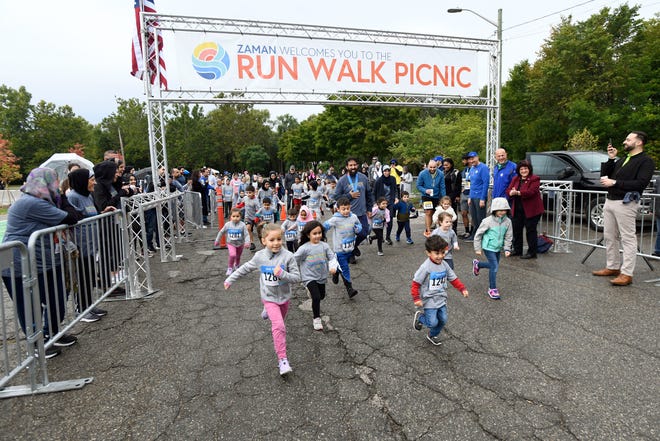 A 100 meter fun run for kids ages 2-4 gets underway at the Zaman International 13th annual Run Walk Picnic at Ford Field Park, Saturday, Sept. 24, 2022, in Dearborn.
 The event raises awareness about Zaman’s work to eradicate poverty, and proceeds benefit programming that supports women and children facing extreme poverty. 
This is the first full in-person Run Walk Picnic since fall of 2019 due to the pandemic.