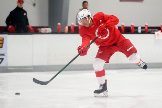 Right wing Dominik Shine shoots the puck during the Red Wings’ training camp at Centre Ice Arena.