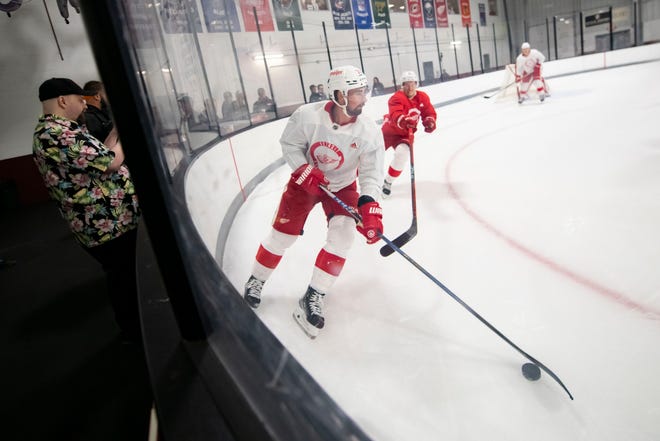 Center Dylan Larkin skates the puck through the corner during the Red Wings’ training camp at Centre Ice Arena.
