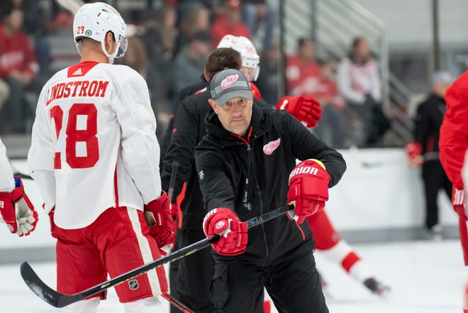 Associate coach Bob Boughner passes the puck during the Red Wings’ training camp at Centre Ice Arena.