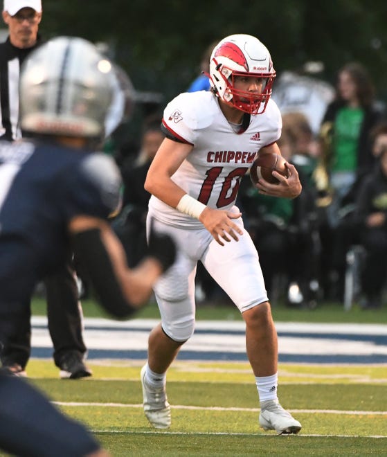Chippewa quarterback Andres Schuster looks for running room in the first half.