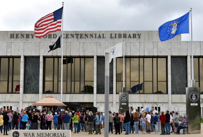 More than 125 people attend the Books Unite Us - Censorship Divides Us rally in front of the Henry Ford Centennial Library in Dearborn, as they protest the banning books from school libraries, Sunday afternoon, September 25, 2022.