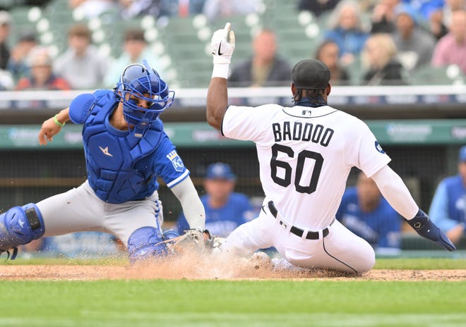Royals catcher MJ Melendez tags Tigers' Akil Baddoo at home, but Baddoo beats the tag in the fifth inning to make it 3-0.