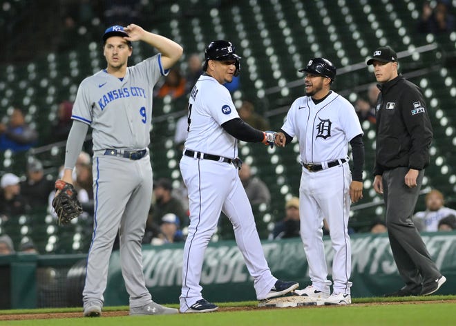 From left, Royals first baseman Vinnie Pasquantino (9) looks on after Tigers designated hitter Miguel Cabrera is greeted by first base coach Alfredo Amezaga after Cabrera singles in the eighth inning.