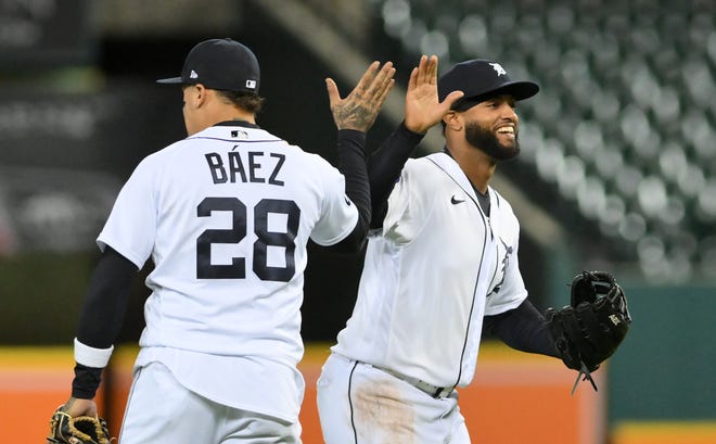 Tigers shortstop Javier Baez and right fielder Willi Castro congratulate each other after the win.