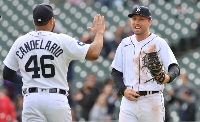 Detroit Tigers third baseman Jeimer Candelario (46) celebrates with first baseman Kody Clemens after beating the Kansas City Royals at Comerica Park in Detroit on Sept. 29, 2022. The Tigers won, 10-3.