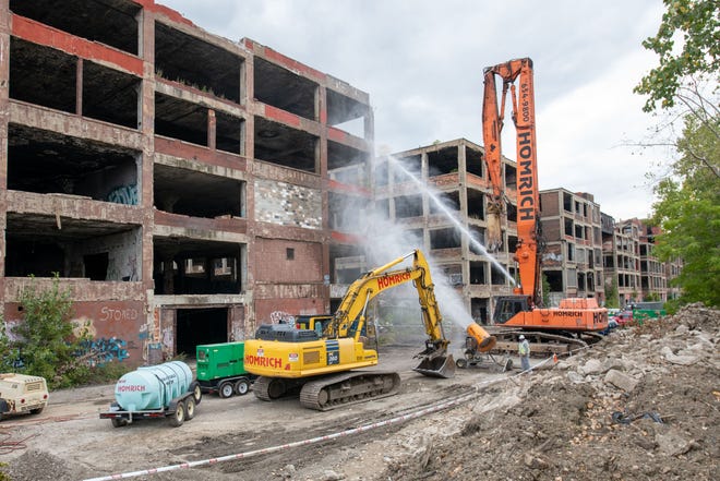 Water is sprayed before the start of demolition of one building of the former Packard plant, in Detroit, September 29, 2022.