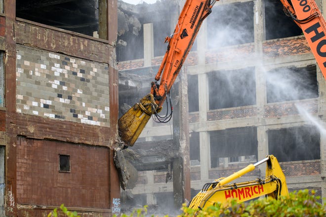 Demolition equipment begins work on tearing down one building of the former Packard plant, in Detroit, September 29, 2022.