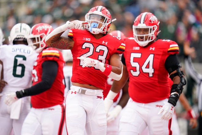 Maryland running back Colby McDonald (23) reacts after scoring a touchdown against Michigan State during the first half.