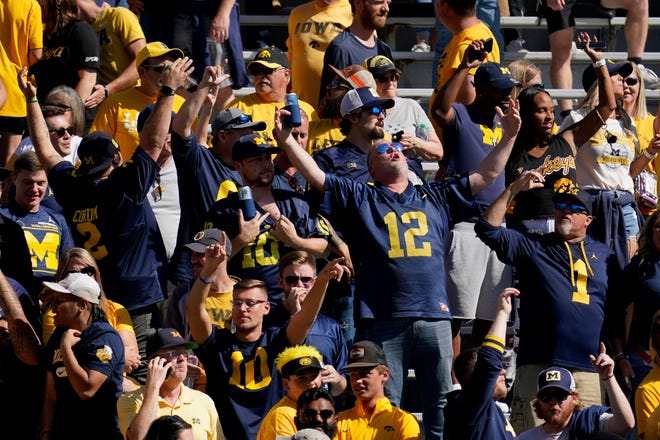 Michigan fans cheer during the second half.
