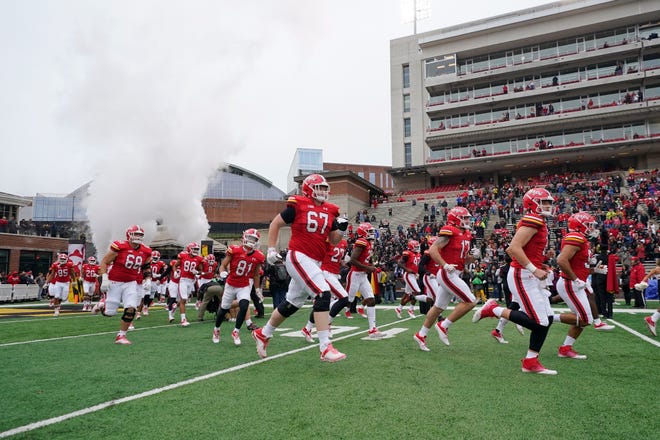 Maryland players take the field prior to the game.