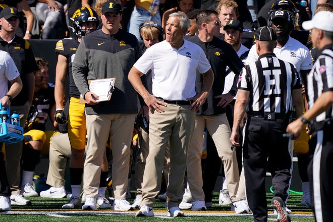 Iowa head coach Kirk Ferentz, center, watches from the sideline during the first half.