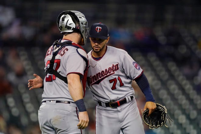 Minnesota Twins relief pitcher Jovani Moran greets catcher Ryan Jeffers after the ninth inning of a baseball game against the Detroit Tigers, Friday, Sept. 30, 2022, in Detroit.