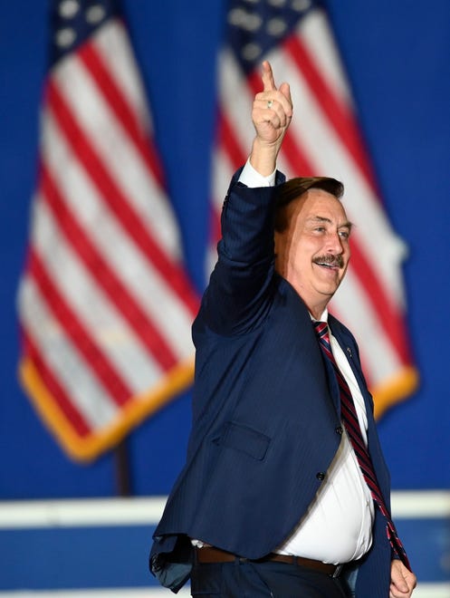 Mike Lindell heads to the podium at a Donald Trump rally in Warren, Saturday, October 1, 2022.