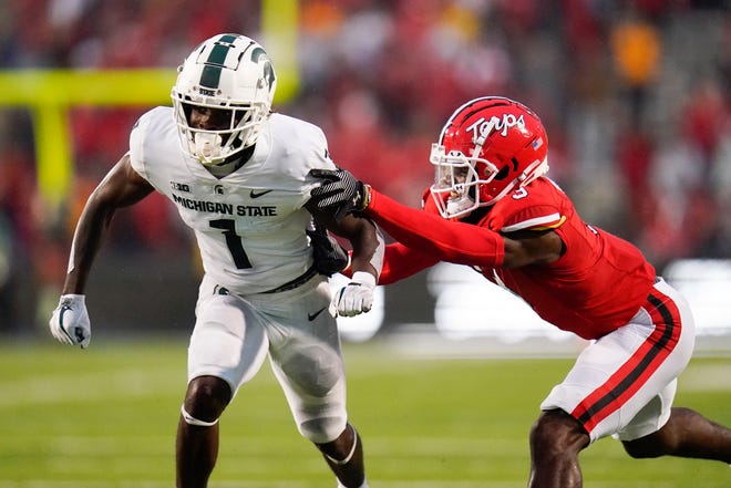 Michigan State wide receiver Jayden Reed (1) runs a route as Maryland defensive back Deonte Banks defends during the second half.