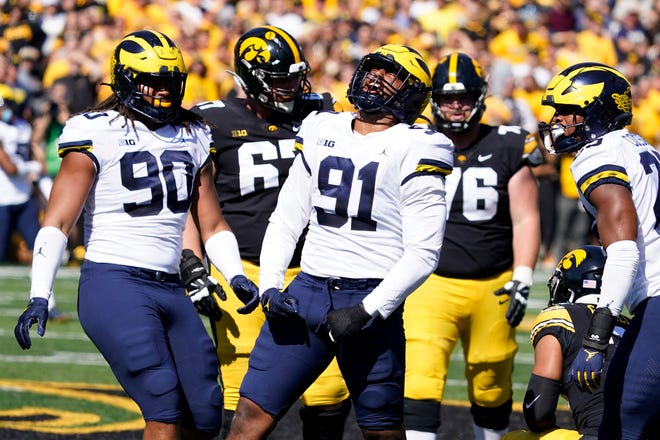 Michigan linebacker Taylor Upshaw (91) celebrates after making a tackle during the first half against Iowa.