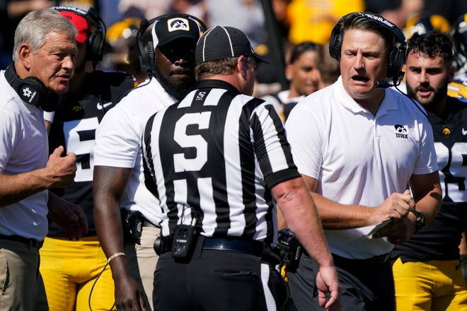 Iowa offensive coordinator Brian Ferentz, right, questions a call during the second half.