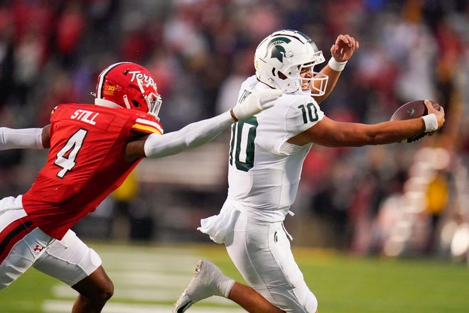 Michigan State quarterback Payton Thorne (10) runs with the ball as Maryland defensive back Tarheeb Still (4) tries to stop him during the second half on Saturday, Oct. 1, 2022, in College Park, Maryland. Michigan State lost, 27-13.