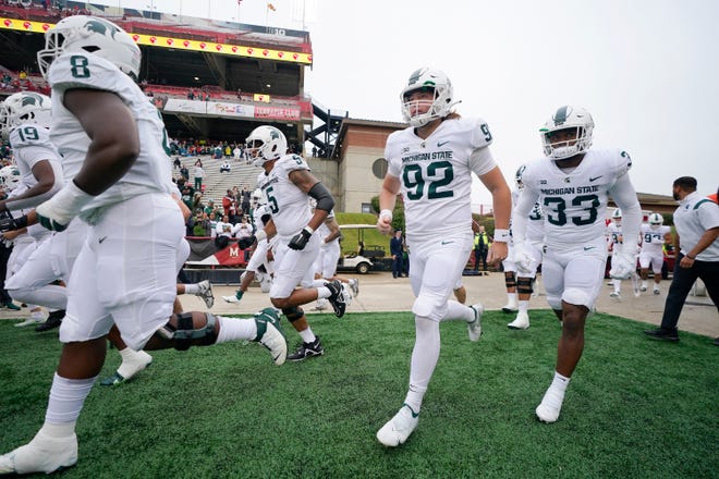 Michigan State players take the field prior to the game.