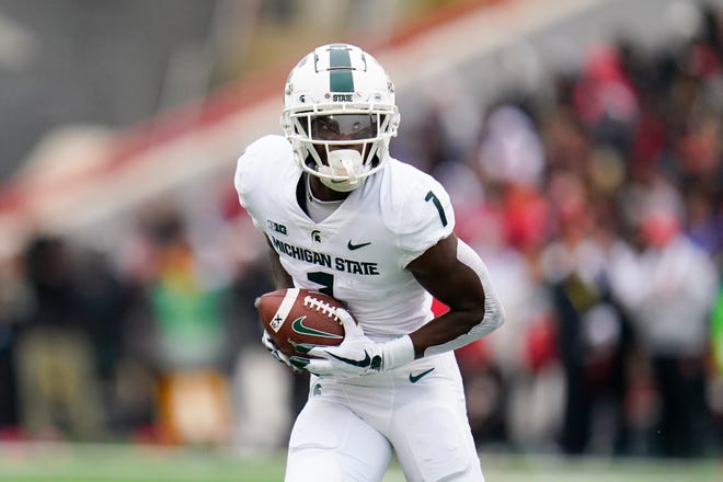 Michigan State wide receiver Jayden Reed runs with the ball after making a catch against Maryland during the first half.