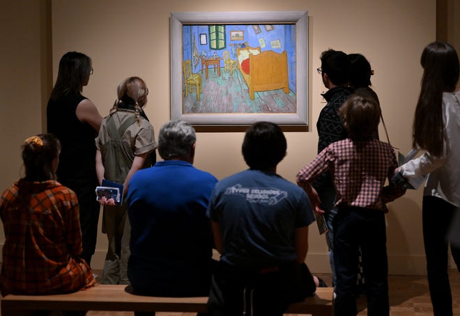 People look at "The Bedroom" at the Van Gogh exhibit at the Detroit Institute of Arts in Detroit on Oct. 2, 2022.