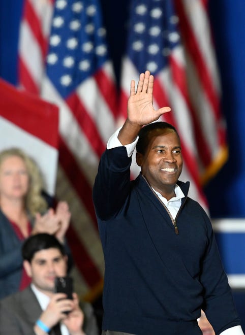 U.S. Republican Congressional candidate John James waves to the crowd after speaking at a Donald Trump rally at the Macomb Community College Sports & Expo Center in Warren, Saturday, October 1, 2022.