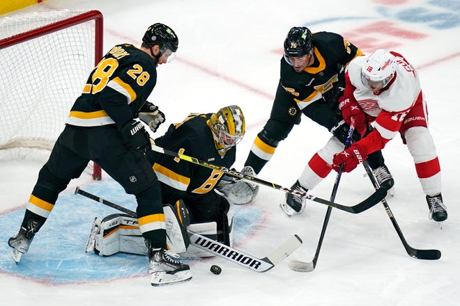 Boston Bruins goaltender Jeremy Swayman (1) drops to the ice to make a save on a shot by Detroit Red Wings center Andrew Copp (18) during the first period of an NHL hockey game, Thursday, Oct. 27, 2022, in Boston. (AP Photo/Charles Krupa)
