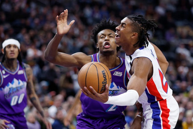 Detroit Pistons guard Jaden Ivey (23), right, drives against Utah Jazz guard Collin Sexton (2) on the first half during an NBA basketball game, Wednesday, Nov. 23, 2022, in Salt Lake City. (AP Photo/Jeff Swinger)