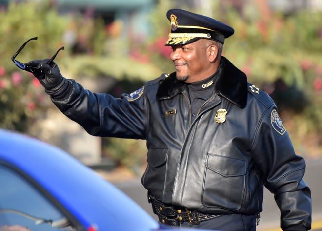 Detroit Police Chief James White waves during the parade.