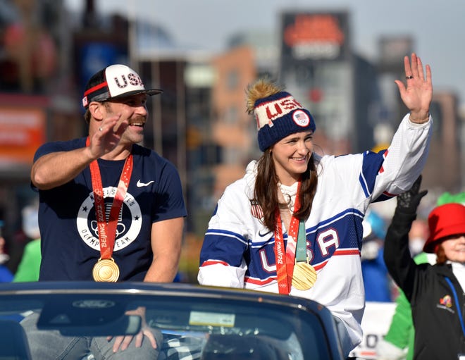 Olympians Nick Baumgartner and Megan Keller wave during the parade.