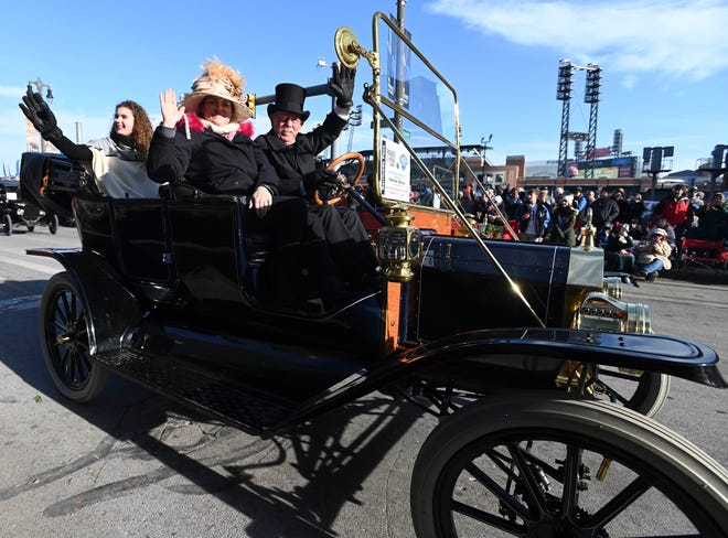 People ride in their 1911 Model T Ford during the parade.