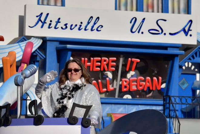 A DJ waves on the Hitsville U.S.A. float during the parade.