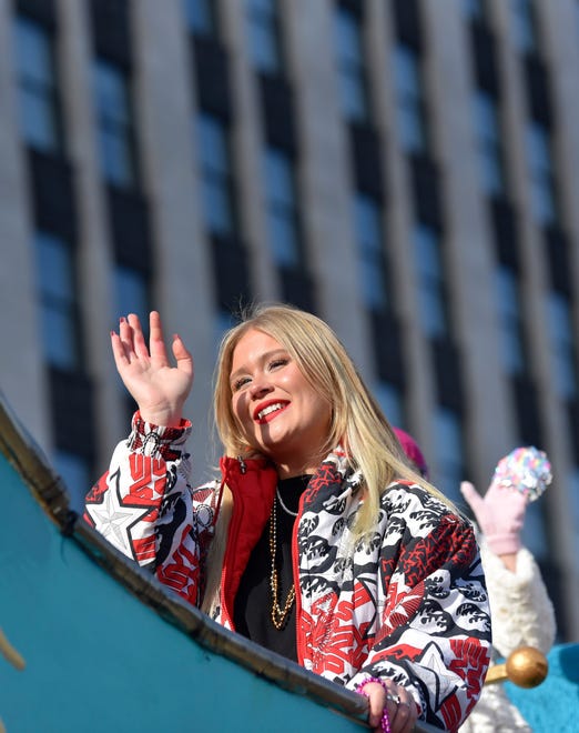 America's Got Talent semi-finalist Ava Swiss, of Oxford, waves as she rides The Detroit News float during the parade.