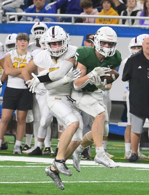 De La Salle's Griffin Phillips can't stop a reception by Forest HIlls' Ty Hukins in the first half.