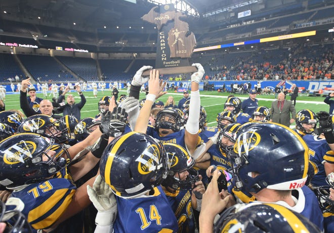 Ottawa Lake Whiteford celebrates their 26-20 division 8 MHSAA Championship over Ubly at Ford Field in Detroit, Michigan on November 25, 2022.